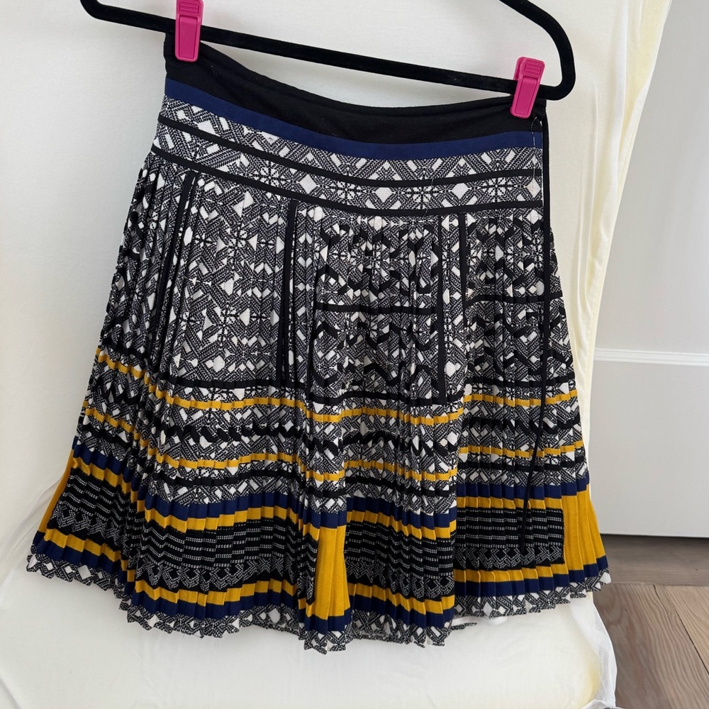 Above knee pleated skirt